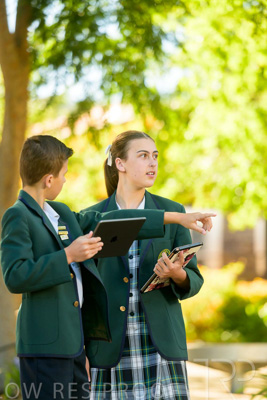 January 2024 / Students-x2-with-Pad-standing-outdors_240122_Z9E6644