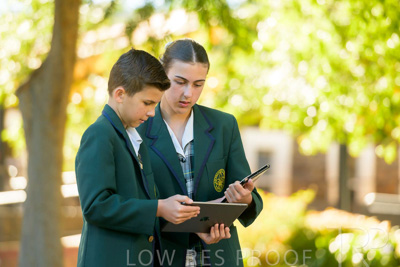 January 2024 / Students-x2-with-Pad-standing-outdors_240122_Z9E6916