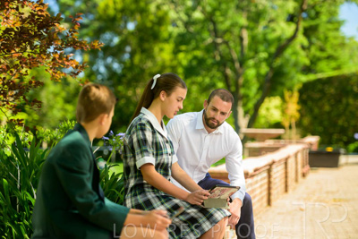 January 2024 / Teacher-with-2-Student-Sitting-Outdoors_240122_Z9E7860