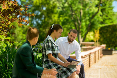 January 2024 / Teacher-with-2-Student-Sitting-Outdoors_240122_Z9E7864