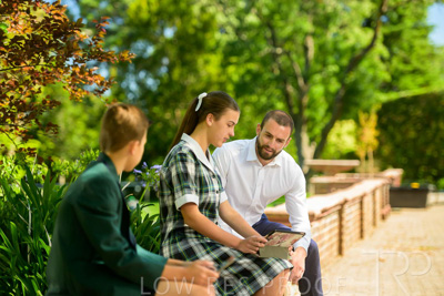 January 2024 / Teacher-with-2-Student-Sitting-Outdoors_240122_Z9E7868