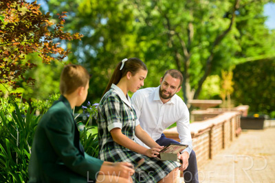 January 2024 / Teacher-with-2-Student-Sitting-Outdoors_240122_Z9E7885