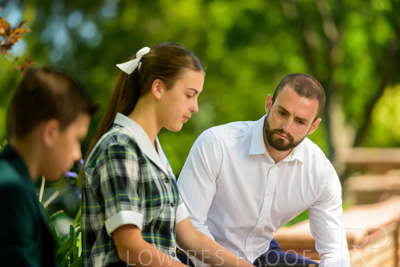 January 2024 / Teacher-with-2-Student-Sitting-Outdoors_240122_Z9E7909