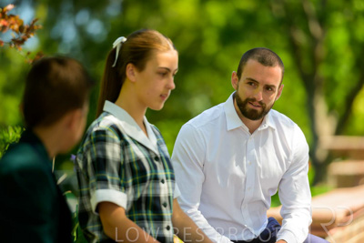 January 2024 / Teacher-with-2-Student-Sitting-Outdoors_240122_Z9E7979
