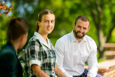 January 2024 / Teacher-with-2-Student-Sitting-Outdoors_240122_Z9E7984