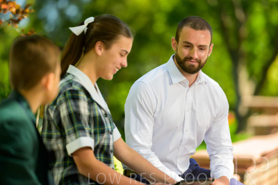 January 2024 / Teacher-with-2-Student-Sitting-Outdoors_240122_Z9E8018