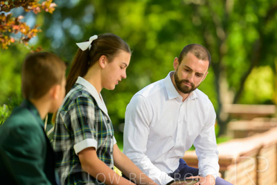 January 2024 / Teacher-with-2-Student-Sitting-Outdoors_240122_Z9E8029