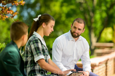 January 2024 / Teacher-with-2-Student-Sitting-Outdoors_240122_Z9E8066