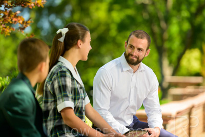 January 2024 / Teacher-with-2-Student-Sitting-Outdoors_240122_Z9E8074