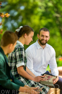 January 2024 / Teacher-with-2-Student-Sitting-Outdoors_240122_Z9E8144