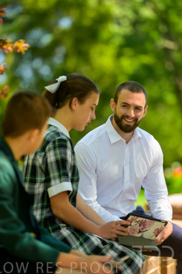 January 2024 / Teacher-with-2-Student-Sitting-Outdoors_240122_Z9E8145