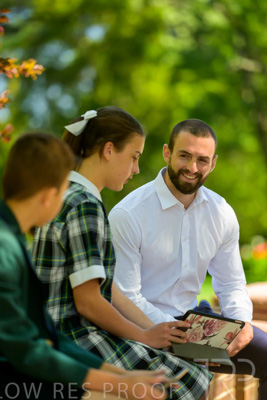 January 2024 / Teacher-with-2-Student-Sitting-Outdoors_240122_Z9E8146