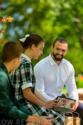 January 2024 / Teacher-with-2-Student-Sitting-Outdoors_240122_Z9E8147