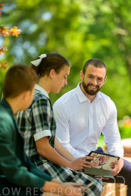 January 2024 / Teacher-with-2-Student-Sitting-Outdoors_240122_Z9E8148