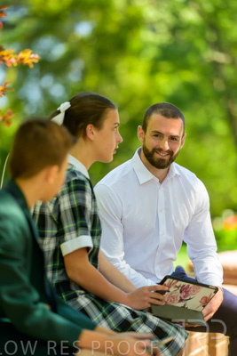 January 2024 / Teacher-with-2-Student-Sitting-Outdoors_240122_Z9E8152