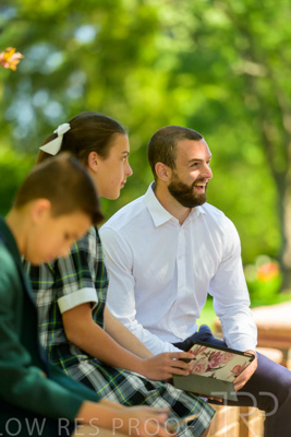 January 2024 / Teacher-with-2-Student-Sitting-Outdoors_240122_Z9E8154