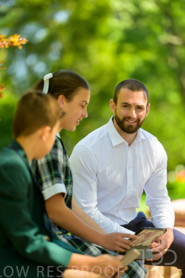 January 2024 / Teacher-with-2-Student-Sitting-Outdoors_240122_Z9E8160