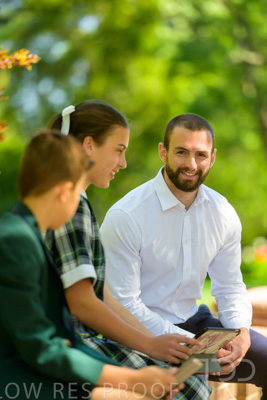 January 2024 / Teacher-with-2-Student-Sitting-Outdoors_240122_Z9E8161