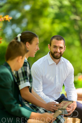January 2024 / Teacher-with-2-Student-Sitting-Outdoors_240122_Z9E8164