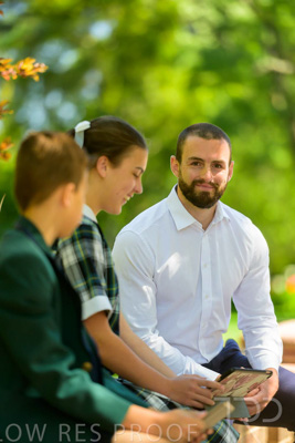 January 2024 / Teacher-with-2-Student-Sitting-Outdoors_240122_Z9E8175