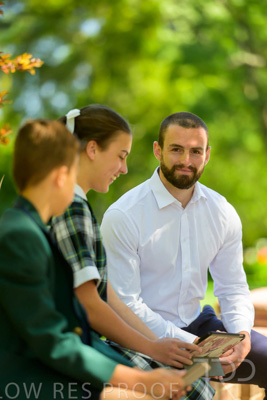 January 2024 / Teacher-with-2-Student-Sitting-Outdoors_240122_Z9E8177