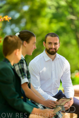 January 2024 / Teacher-with-2-Student-Sitting-Outdoors_240122_Z9E8181