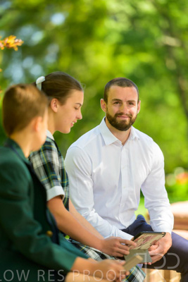 January 2024 / Teacher-with-2-Student-Sitting-Outdoors_240122_Z9E8186