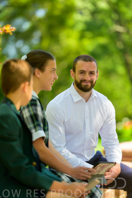 January 2024 / Teacher-with-2-Student-Sitting-Outdoors_240122_Z9E8189
