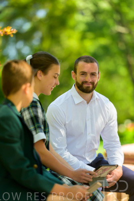 January 2024 / Teacher-with-2-Student-Sitting-Outdoors_240122_Z9E8191