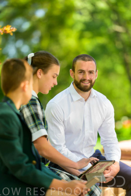 January 2024 / Teacher-with-2-Student-Sitting-Outdoors_240122_Z9E8194