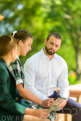 January 2024 / Teacher-with-2-Student-Sitting-Outdoors_240122_Z9E8202