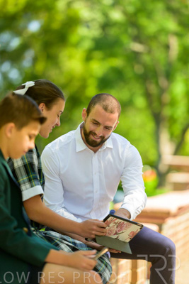 January 2024 / Teacher-with-2-Student-Sitting-Outdoors_240122_Z9E8224
