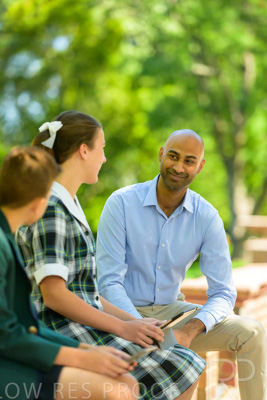 January 2024 / Teacher-with-2-Student-Sitting-Outdoors_240122_Z9E8280