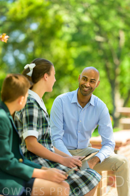 January 2024 / Teacher-with-2-Student-Sitting-Outdoors_240122_Z9E8301