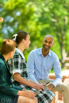 January 2024 / Teacher-with-2-Student-Sitting-Outdoors_240122_Z9E8304