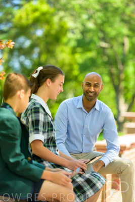 January 2024 / Teacher-with-2-Student-Sitting-Outdoors_240122_Z9E8316