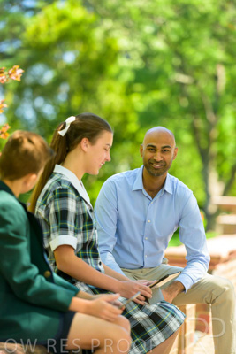 January 2024 / Teacher-with-2-Student-Sitting-Outdoors_240122_Z9E8321