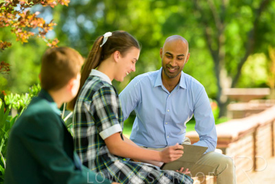 January 2024 / Teacher-with-2-Student-Sitting-Outdoors_240122_Z9E8566