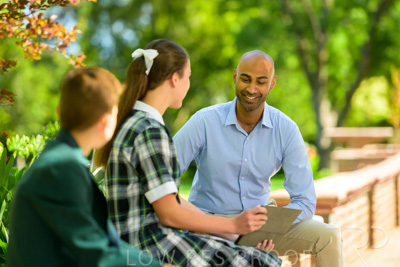 January 2024 / Teacher-with-2-Student-Sitting-Outdoors_240122_Z9E8569