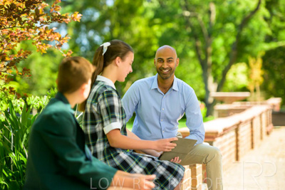 January 2024 / Teacher-with-2-Student-Sitting-Outdoors_240122_Z9E8576