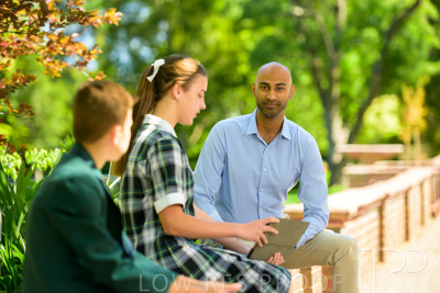 January 2024 / Teacher-with-2-Student-Sitting-Outdoors_240122_Z9E8581