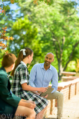January 2024 / Teacher-with-2-Student-Sitting-Outdoors_240122_Z9E8601